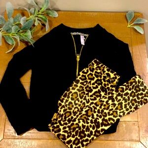 Black sweater with leopard print leggings.
